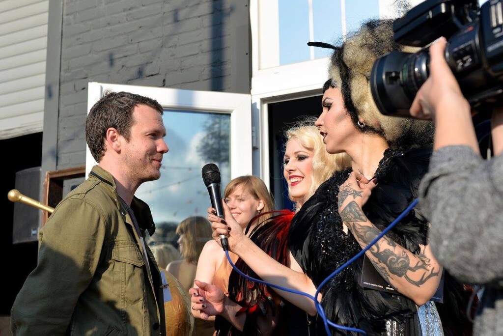 Guests socialising outdoors at the festival